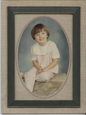 Framed photograph of a girl in a pink outfit