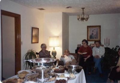 Family sitting around a buffet table