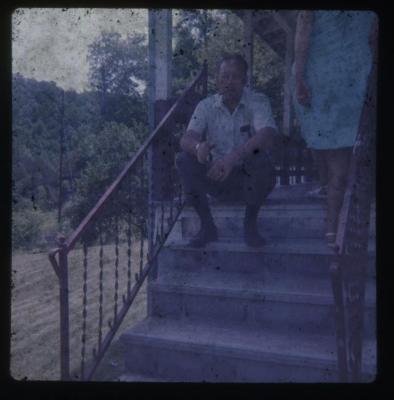 Man and woman on the steps of a house
