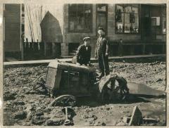Two men with tractor stuck in mud. Neon, KY, 1924