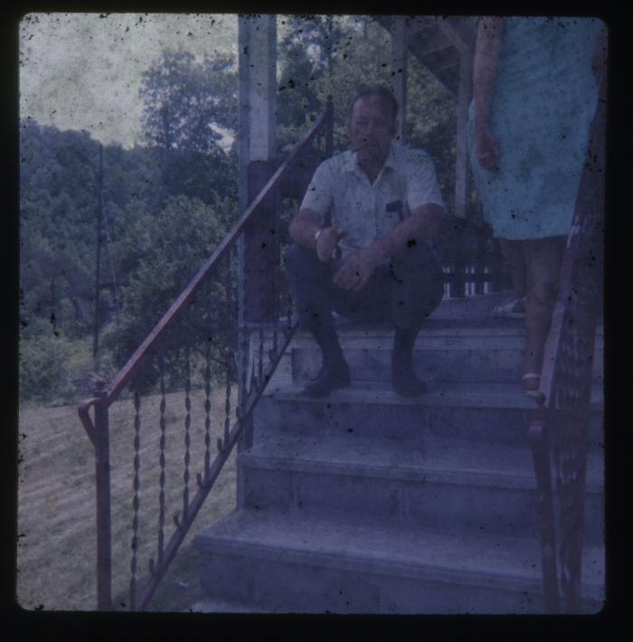 Man and woman on the steps of a house