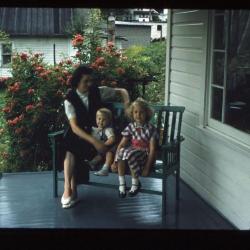 Woman and children sitting on a porch