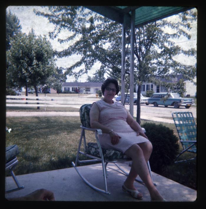 Woman sitting on porch