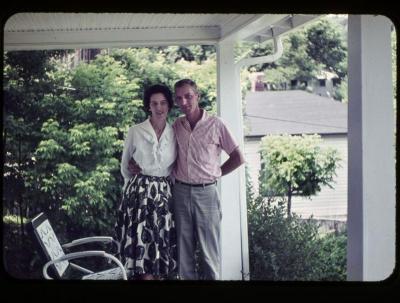 Man and woman standing together on front porch