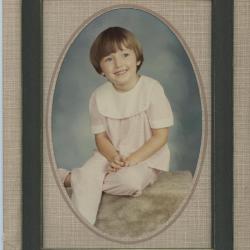 Framed photograph of a girl in a pink outfit