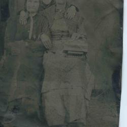 Two women, third person obscured