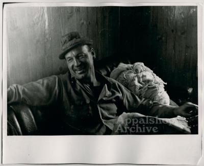 Production still of man smiling - The Struggle of Coon Branch Mountain