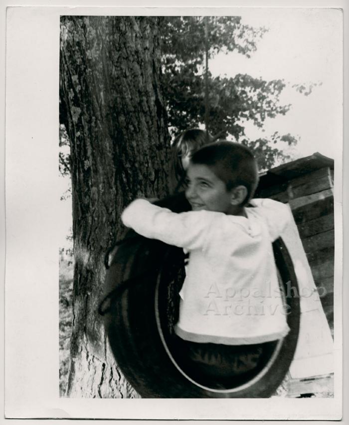 Production still of boy in tire swing - The Struggle of Coon Branch Mountain