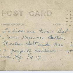 Group of women and children posing for photo