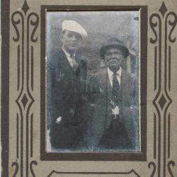 Portrait of two men in novelty cardboard frame