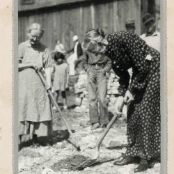 Woman using shovel at groundbreaking