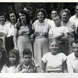 Group of men and women posing for a photograph