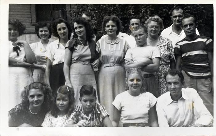 Group of men and women posing for a photograph