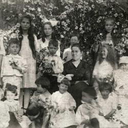 Group of women and children posing for photo
