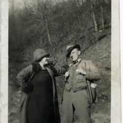 Man and woman posing for a photo outdoors