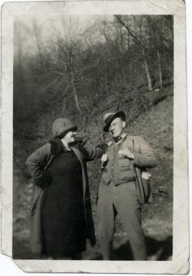 Man and woman posing for a photo outdoors