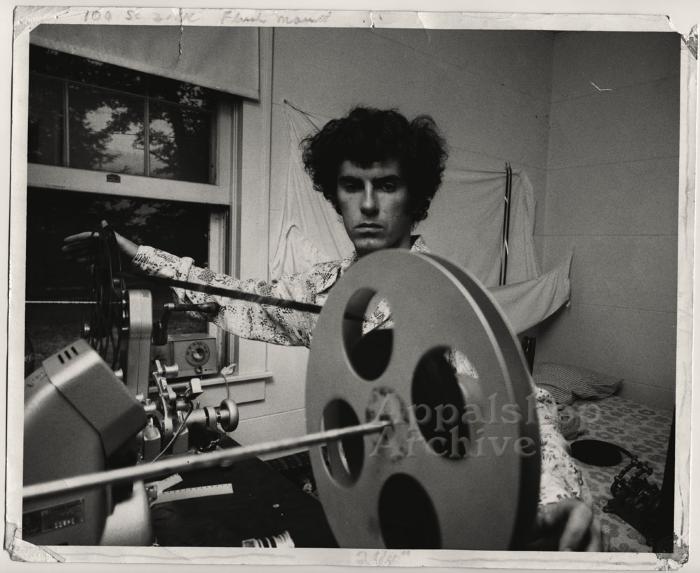 Man [Ben Zickafoose] at rewind table - Coal Miner: Frank Jackson production still