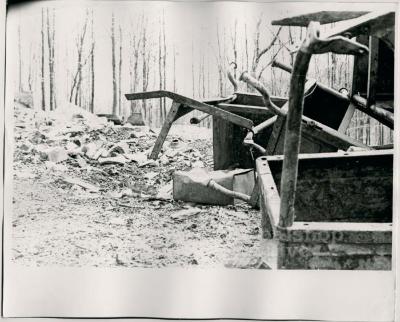 Production still of a pile of school desks, exterior - The Struggle of Coon Branch Mountain