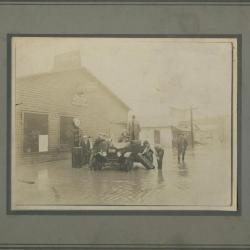 Car stuck on flooded street