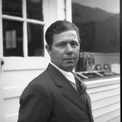 Man posing for a photograph outdoors