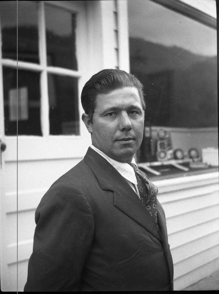 Man posing for a photo outdoors