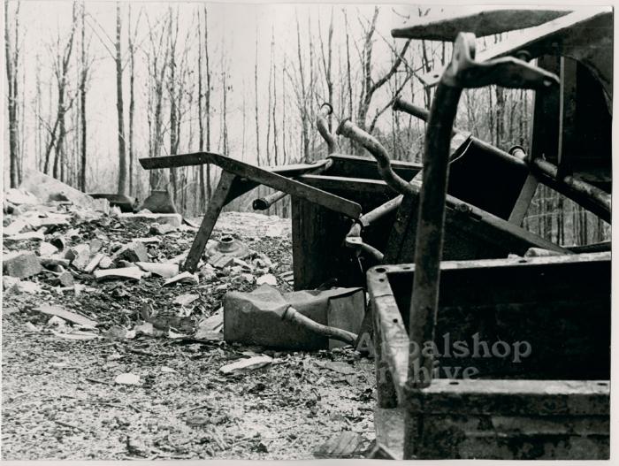 Production still of a pile of school desks - The Struggle of Coon Branch Mountain