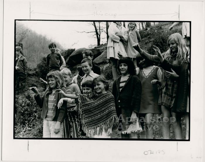 Production still of group of children waving, exterior - The Struggle of Coon Branch Mountain
