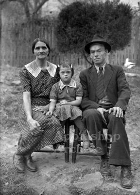 Portrait of a couple sitting with young girl