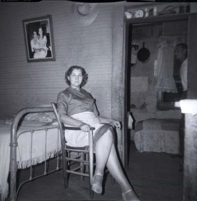 Unidentified woman sitting in chair