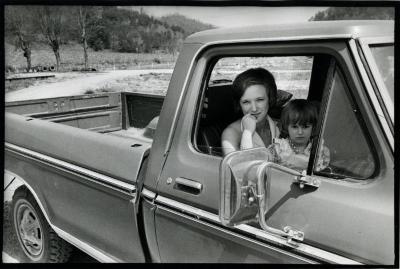 Woman and daughter in pickup truck