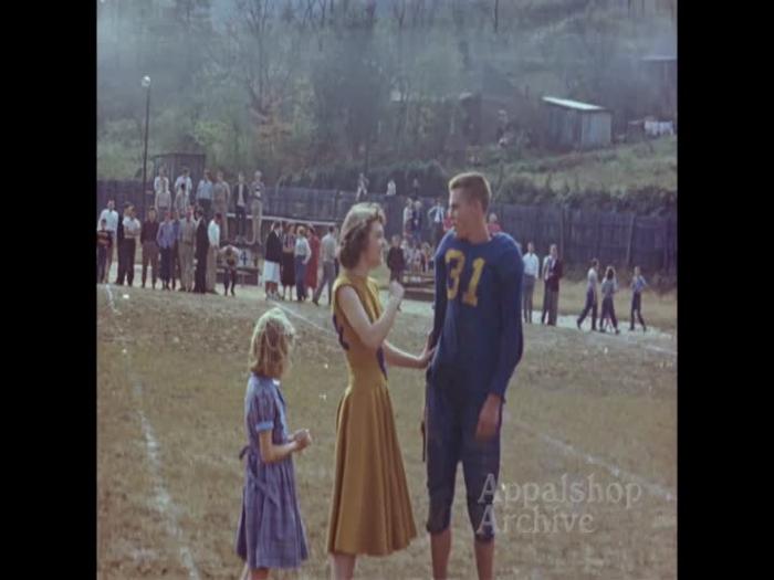 High school football game with cheerleaders (silent)