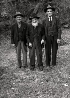 Portrait of three older men, one with cane