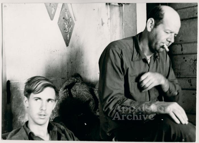 Production still of young man and older man - The Struggle of Coon Branch Mountain
