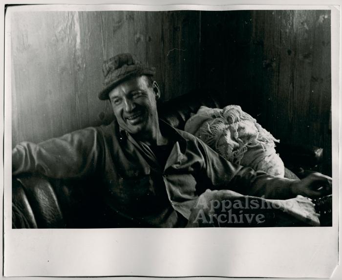 Production still of man smiling - The Struggle of Coon Branch Mountain