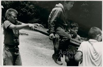 Production still of boys on seesaw - The Struggle of Coon Branch Mountain