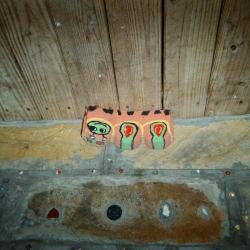 Painted rocks in front of decorated concrete blocks