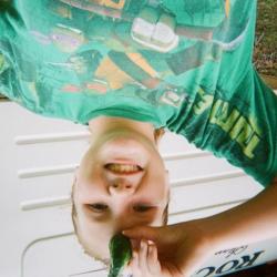 Girl in t-shirt holding vegetable