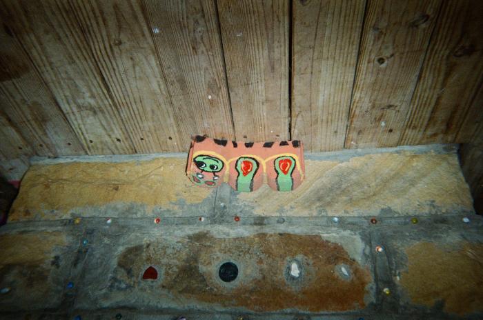Painted rocks in front of decorated concrete blocks
