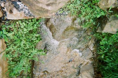 Water running down mountain rock