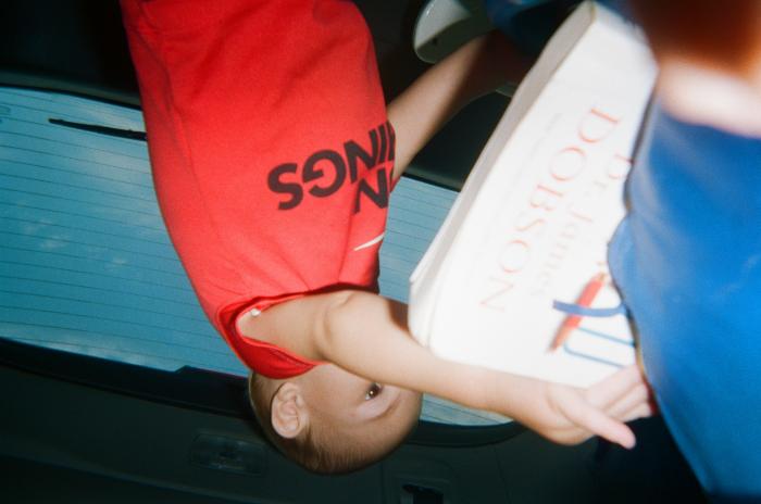 Toddler holding a large book 