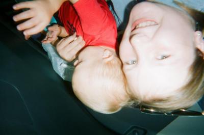 Smiling girl holding toddler