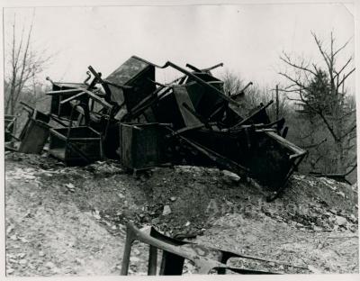 Production still of a pile of school desks, exterior - The Struggle of Coon Branch Mountain