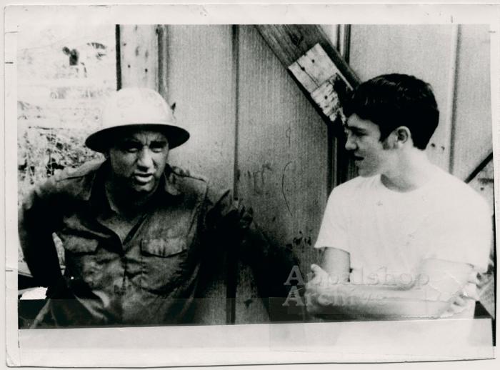 Coal miner and young man in conversation (In Ya Blood)