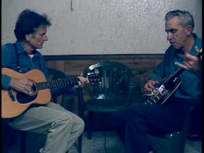Mike Seeger, Arnold Dickens, Hazel Dickens play music in a living room in Princeton, WV