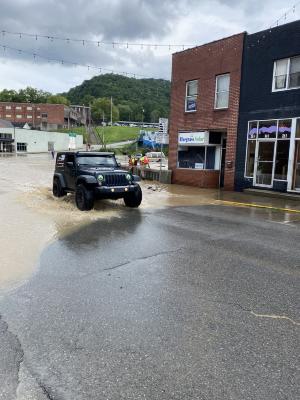 Jeep driving through flood waters