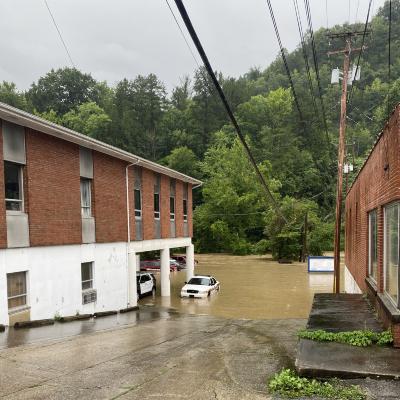 Sherriff's cruiser in river flood waters