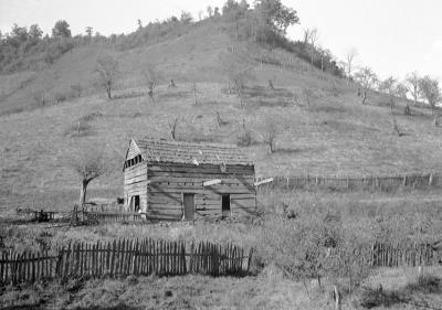 Wooden building at the bottom of hill