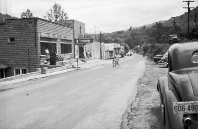 Woman and child crossing street in East Jenkins