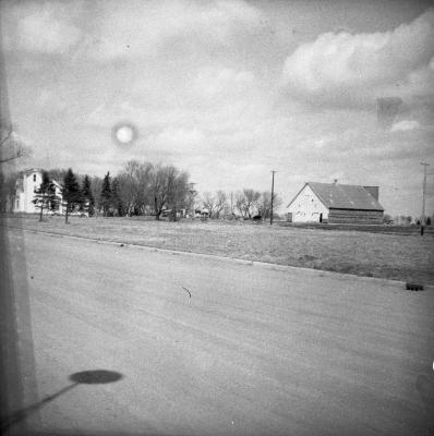 Roadside field and houses