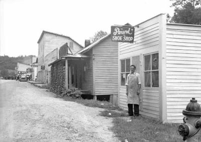 Man posing outside of Pound Shoe Shop